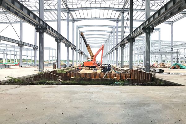Industrial site with orange excavator
